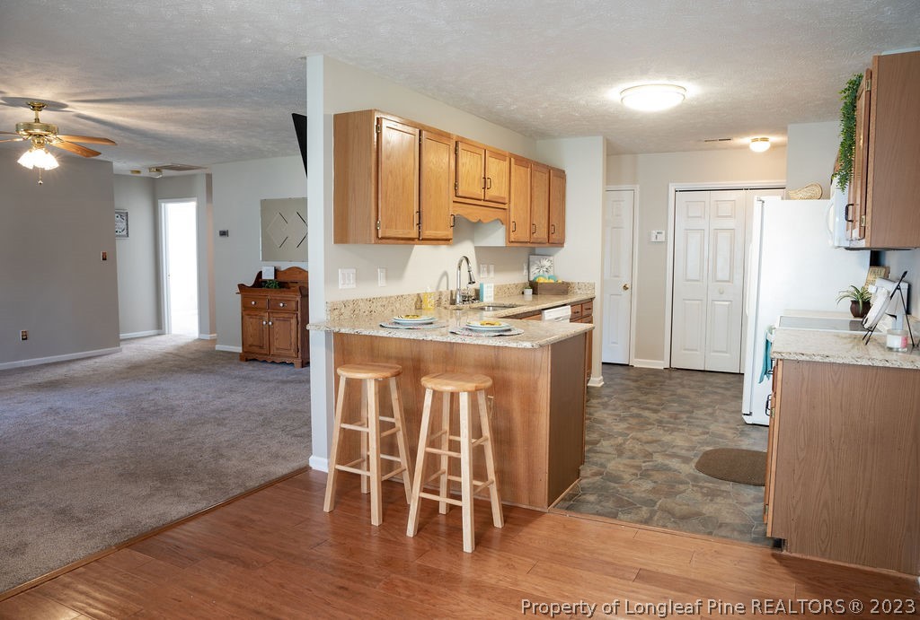 5804 Bibar Road Fayetteville, NC 28304 - Photo 10 of 37 a view of kitchen with granite countertop cabinets table and chairs