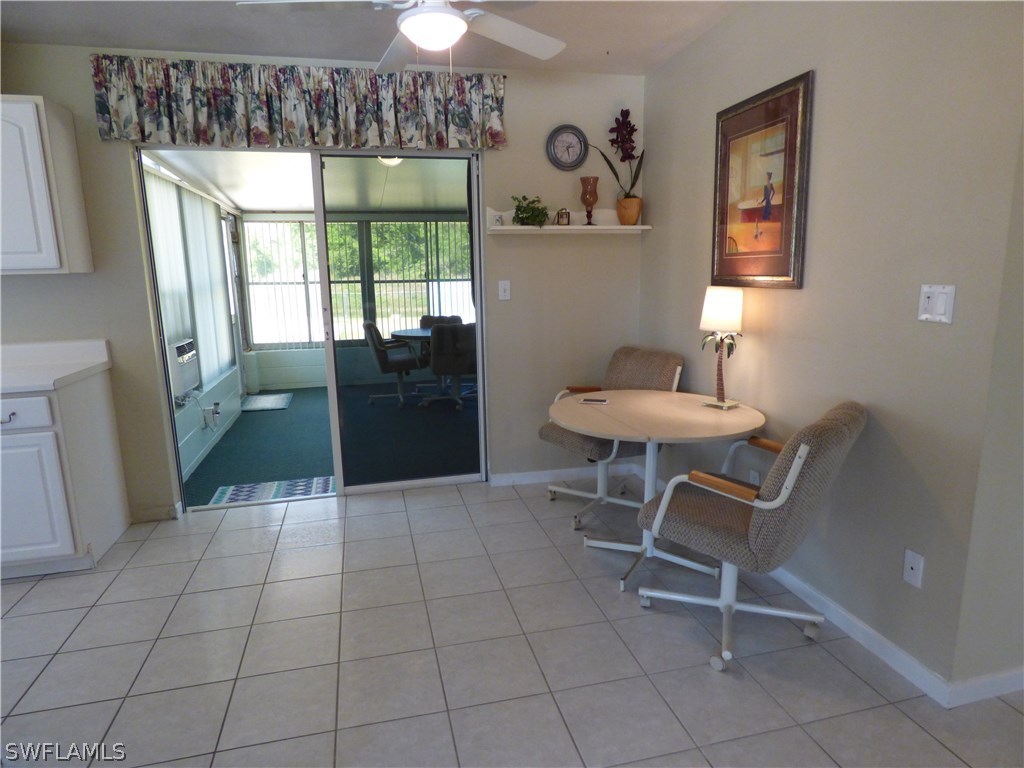 301 Davis Road Lehigh Acres, FL 33936 - Photo 17 of 29 a kitchen with a table and chairs in it