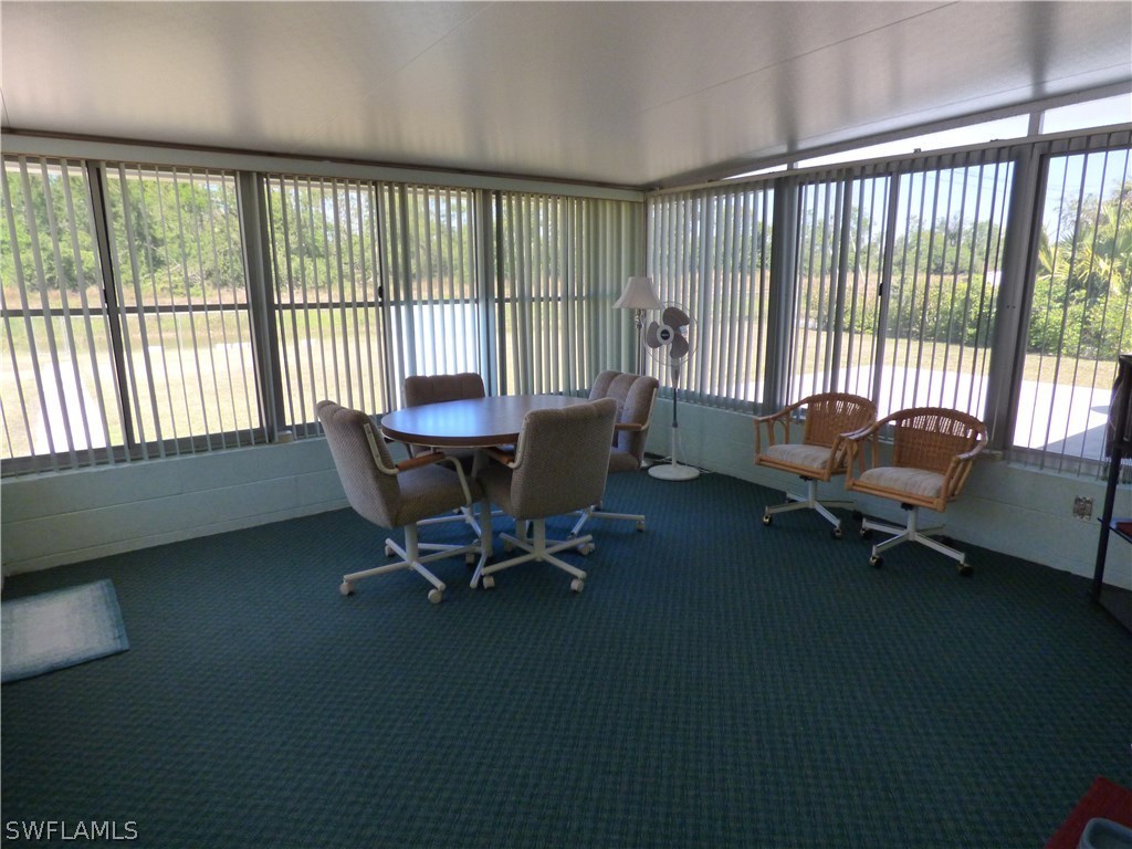 301 Davis Road Lehigh Acres, FL 33936 - Photo 27 of 29 a living room with furniture and a large window