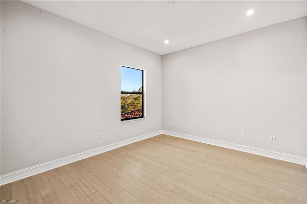 7841 Bristol Circle Naples, FL 34120 - Photo 16 of 28 an empty room with a window