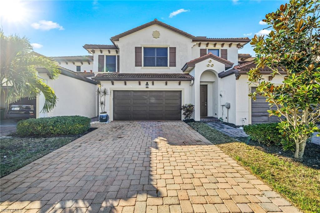 7841 Bristol Circle Naples, FL 34120 - Photo 2 of 28 a front view of a house with garden