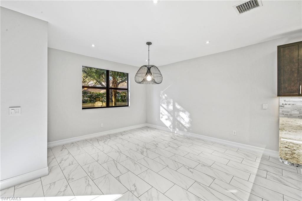 7841 Bristol Circle Naples, FL 34120 - Photo 9 of 28 a view of entryway with wooden floor