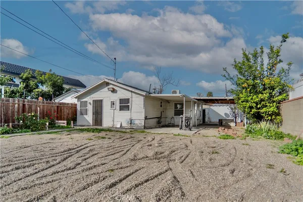 a house with yard in front of it