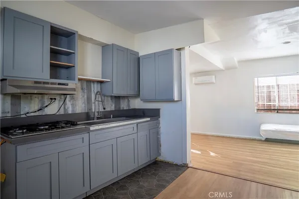 a kitchen with stainless steel appliances granite countertop a stove and a sink