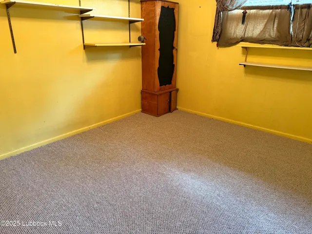 a view of a room with racks on the wall