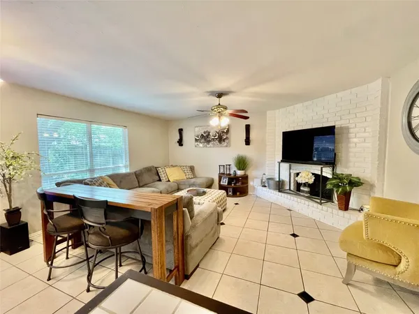 a view of a livingroom with furniture and a flat screen tv