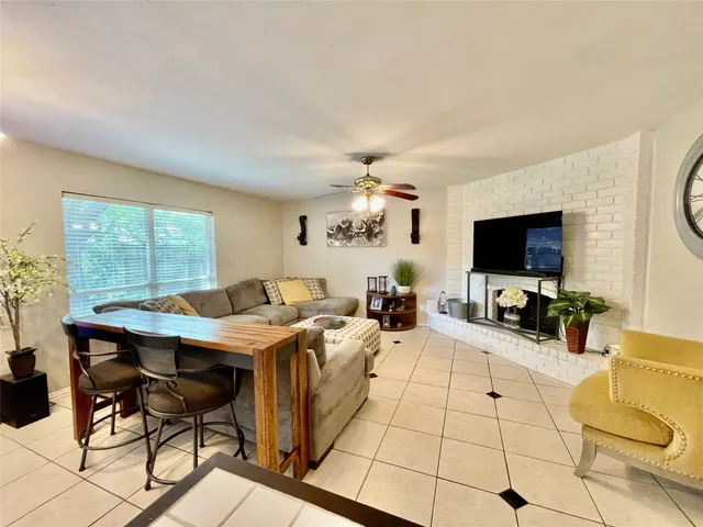 a view of a livingroom with furniture and a flat screen tv
