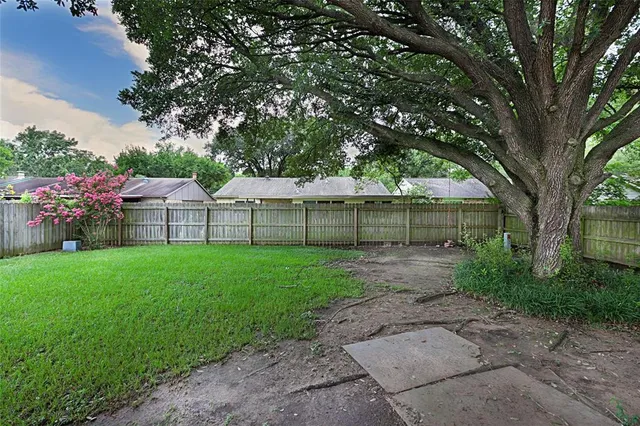 a view of a backyard with a garden