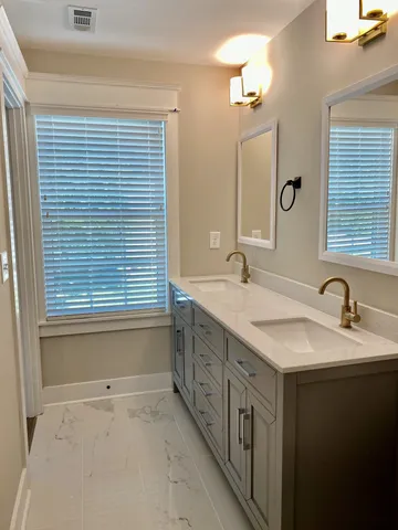 a bathroom with a toilet a sink and bathtub