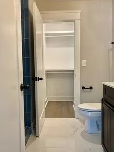 a bathroom with a sink vanity and a mirror