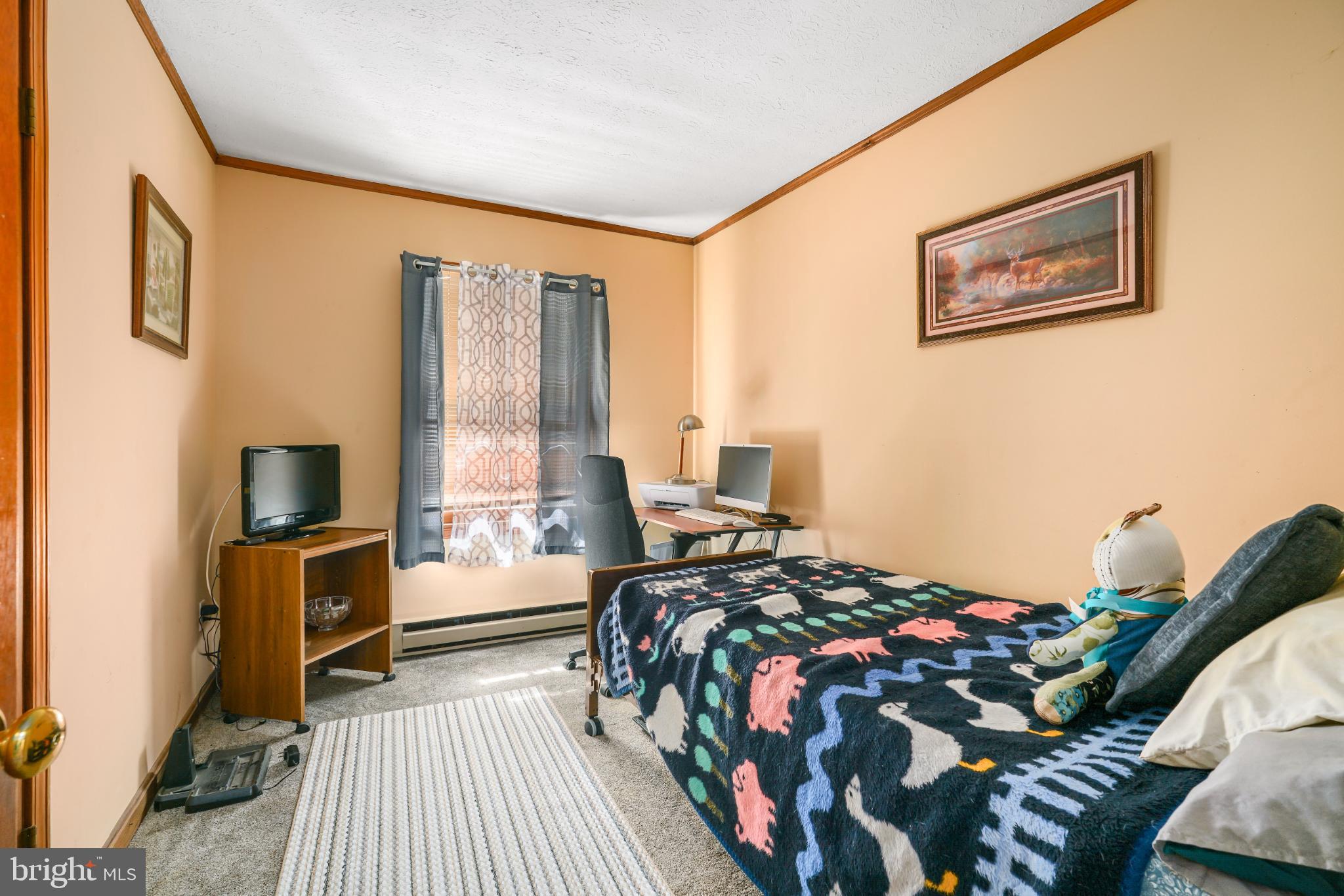 89 Codjus Drive Rising Sun, MD 21911 - Photo 12 of 20 a bedroom with a bed and wooden floor