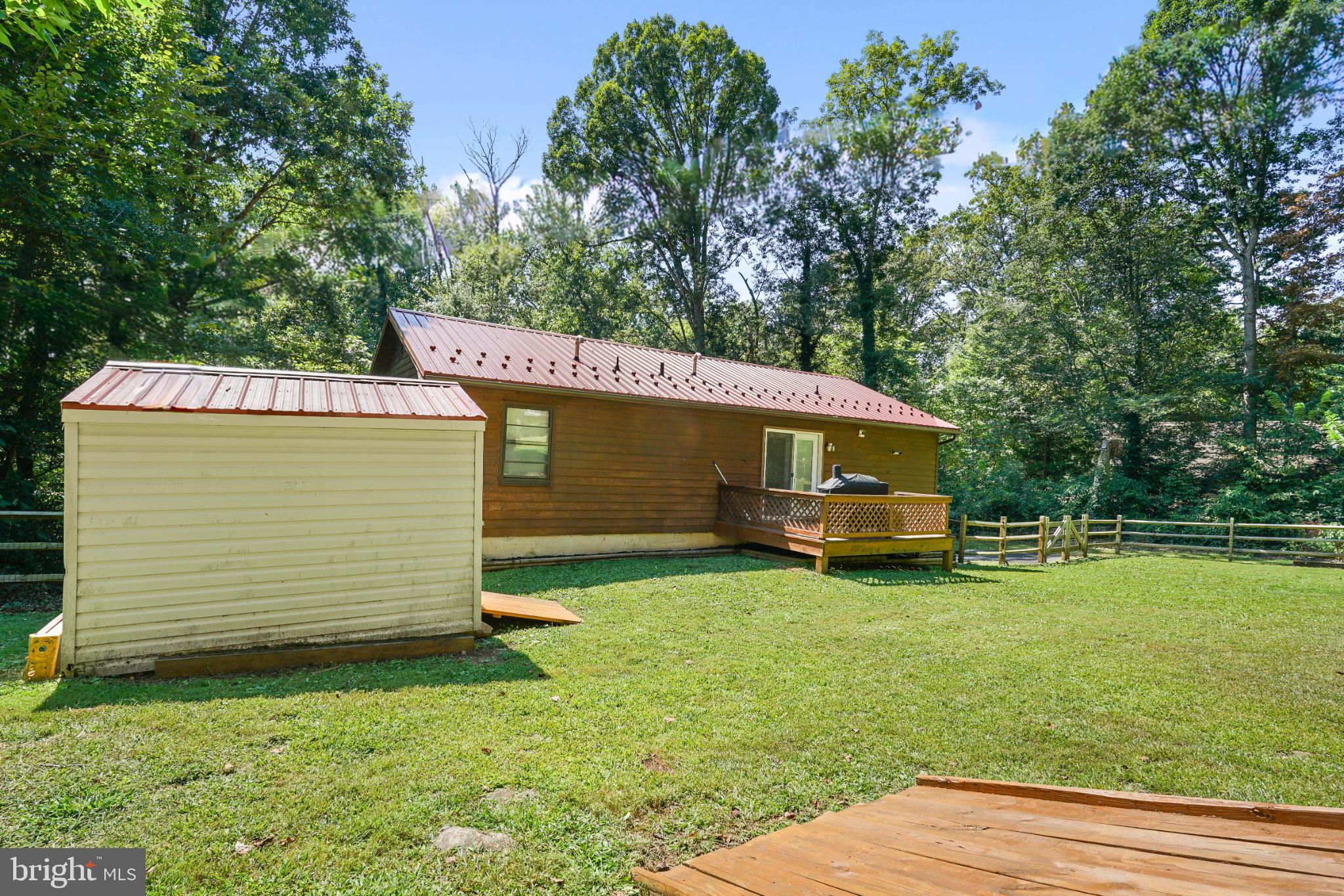 89 Codjus Drive Rising Sun, MD 21911 - Photo 17 of 20 a view of a backyard with a small cabin