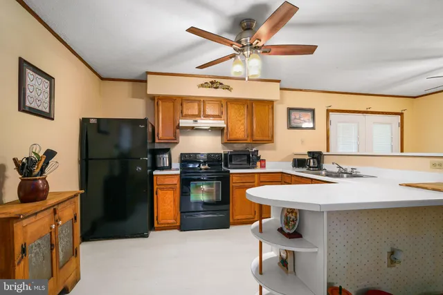 a kitchen with a refrigerator and a sink