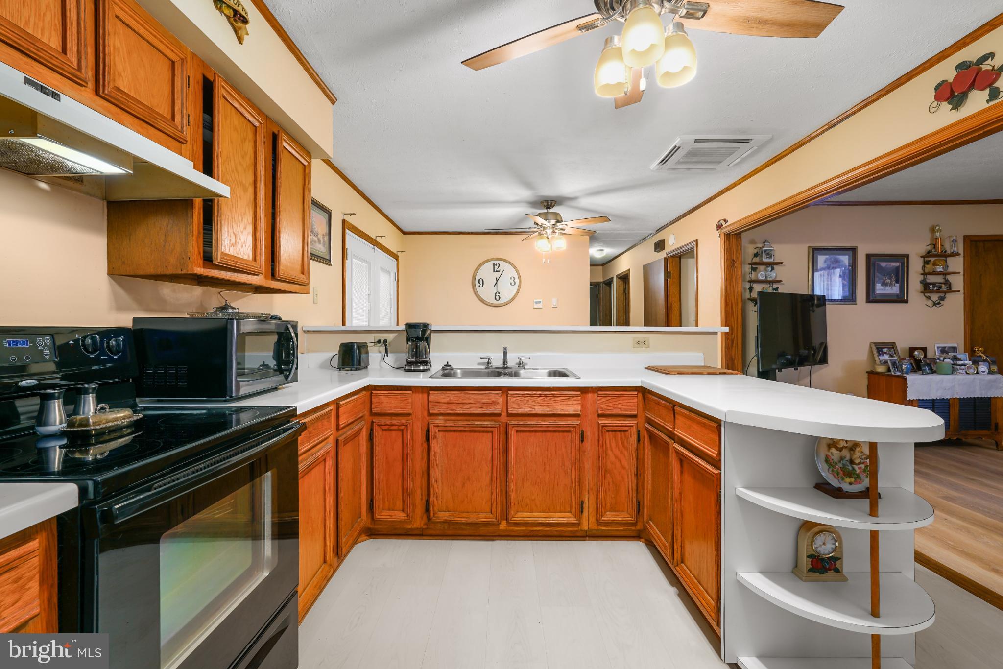 89 Codjus Drive Rising Sun, MD 21911 - Photo 5 of 20 a kitchen with stainless steel appliances granite countertop a sink and cabinets