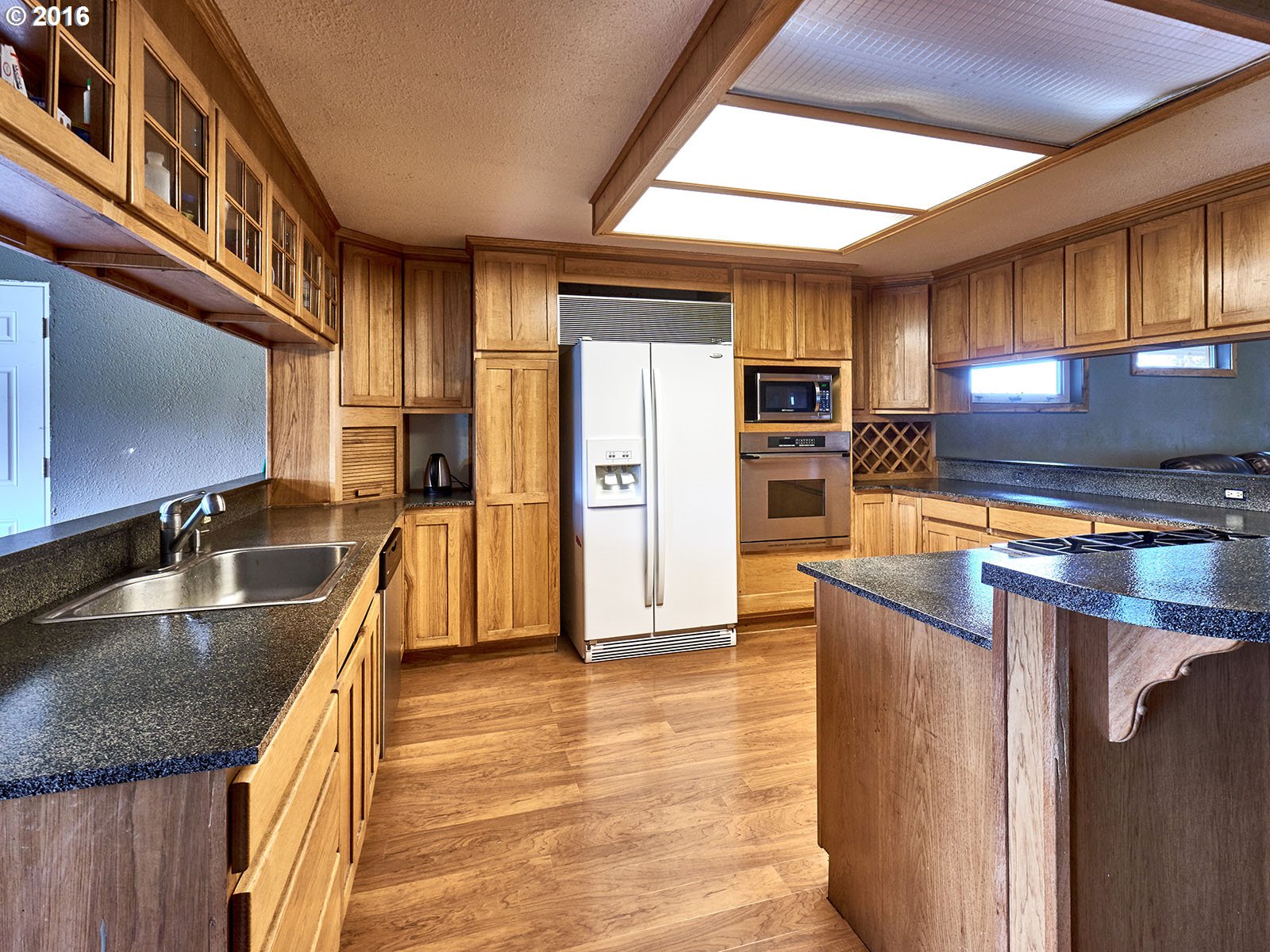 26737 South Look Road Colton, OR 97017 - Photo 17 of 25 a kitchen with stainless steel appliances granite countertop a sink a stove and a refrigerator