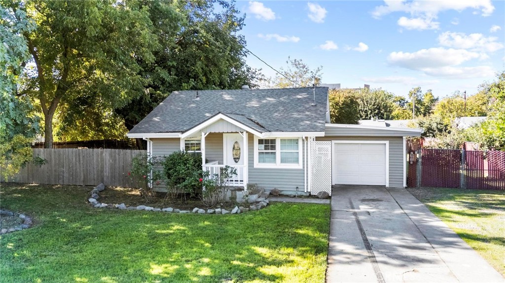 2907 5th Street Biggs, CA 95917 - Photo 1 of 1 a front view of a house with garden