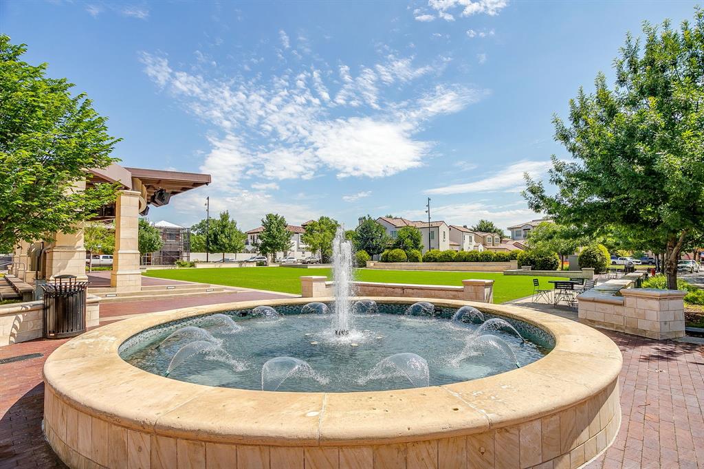 7404 John McCain Road Colleyville, TX 76034 - Photo 16 of 21 a view of a swimming pool with a garden