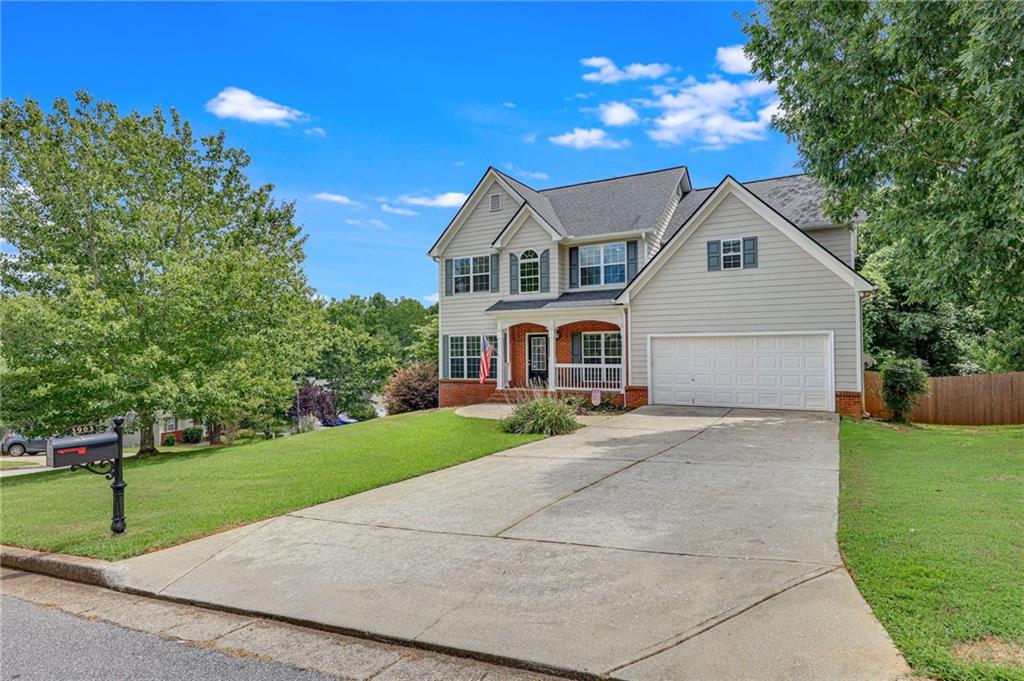 a front view of a house with a yard