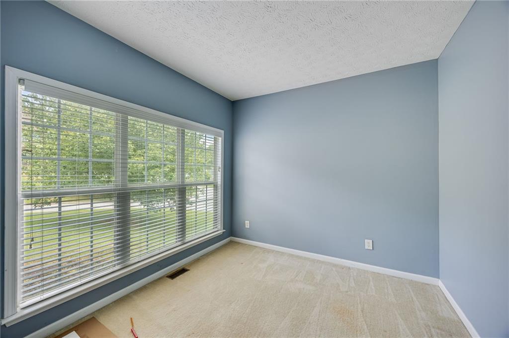 3903 Walnut Grove Way Gainesville, GA 30506 - Photo 14 of 48 a view of an empty room with a large window