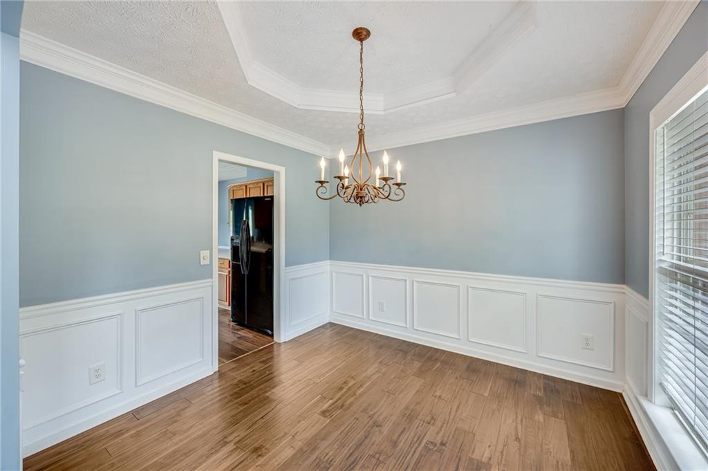 3903 Walnut Grove Way Gainesville, GA 30506 - Photo 15 of 48 a view of an empty room with window and wooden floor