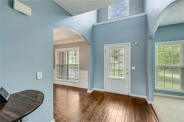 a view of livingroom with hardwood floor and hallway