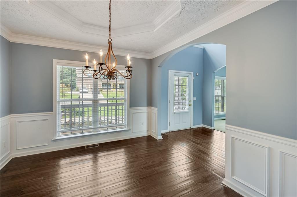 3903 Walnut Grove Way Gainesville, GA 30506 - Photo 18 of 48 a view of an empty room with wooden floor and a window