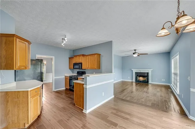 a view of living room kitchen with a flat screen tv