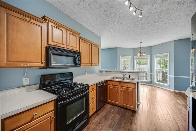 a kitchen with a stove and a microwave