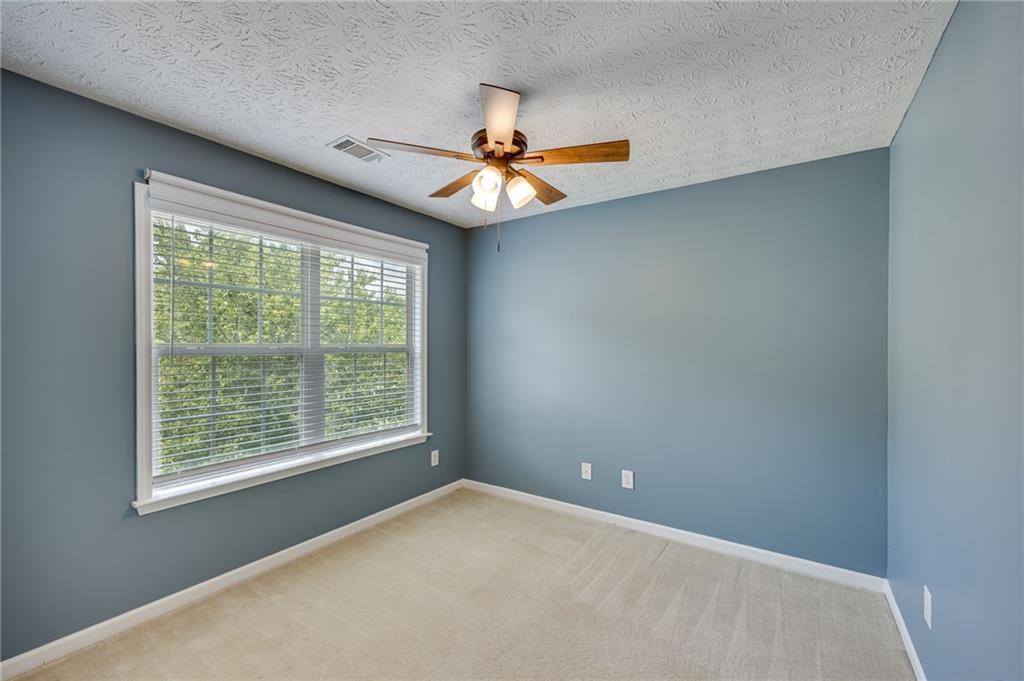 3903 Walnut Grove Way Gainesville, GA 30506 - Photo 33 of 48 a view of a livingroom with a ceiling fan and window