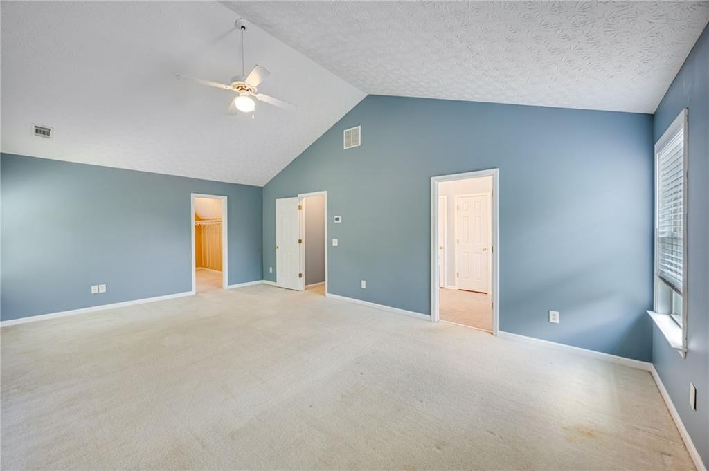 3903 Walnut Grove Way Gainesville, GA 30506 - Photo 42 of 48 a view of an empty room with a chandelier fan