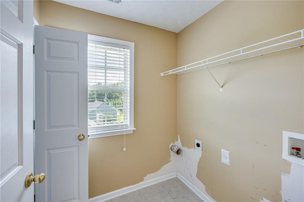 3903 Walnut Grove Way Gainesville, GA 30506 - Photo 45 of 48 a bathroom with a window and shower