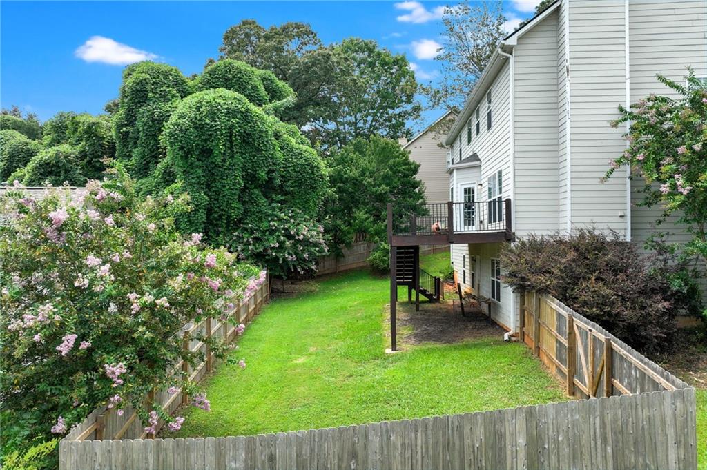 3903 Walnut Grove Way Gainesville, GA 30506 - Photo 10 of 48 a view of a chair and tables front of the house
