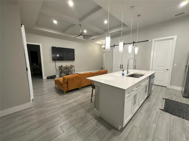 a spacious bathroom with a double vanity sink and a mirror