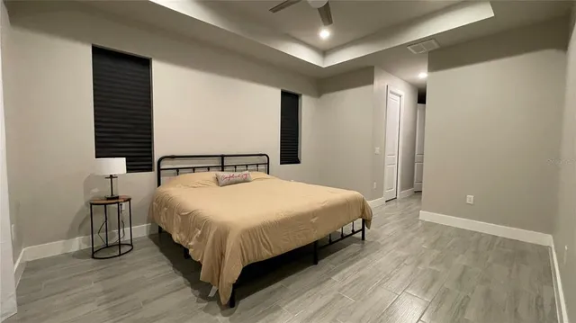 a bedroom with a bed and window