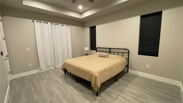 a bedroom with a bed and window