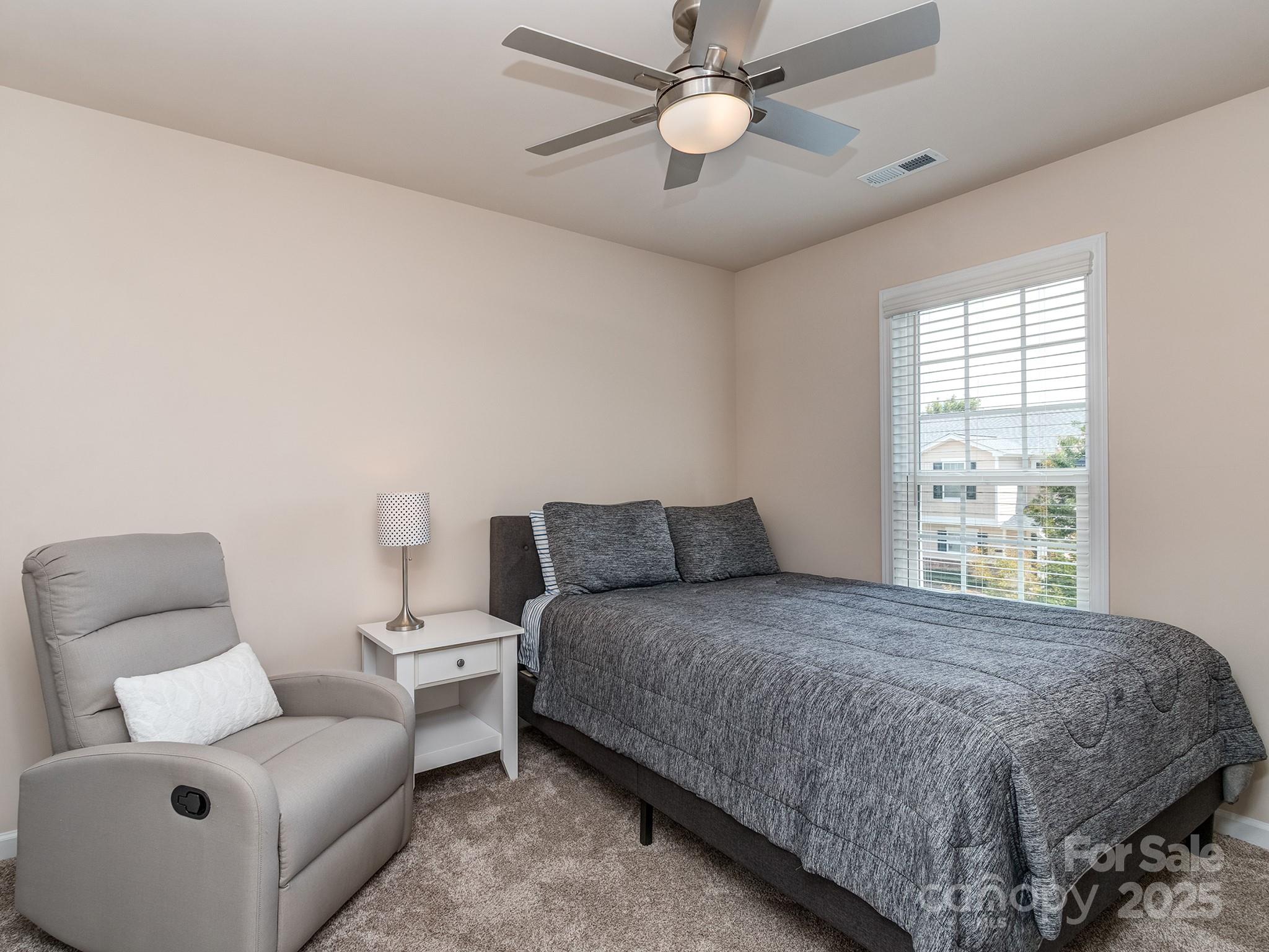 739 Elders Story Road Fort Mill, SC 29708 - Photo 19 of 30 a bedroom with a bed and a couch