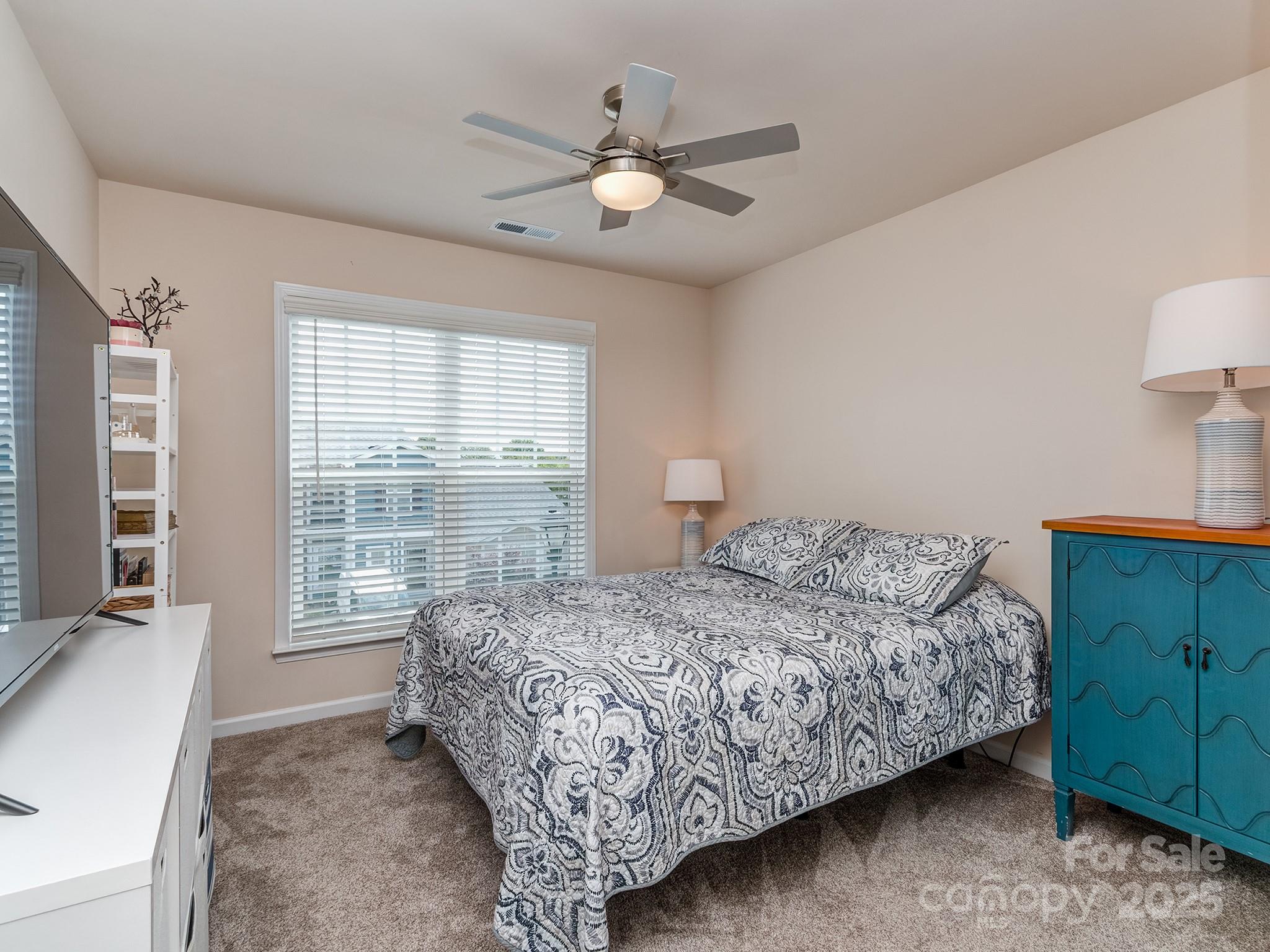 739 Elders Story Road Fort Mill, SC 29708 - Photo 21 of 30 a bedroom with a bed and a window