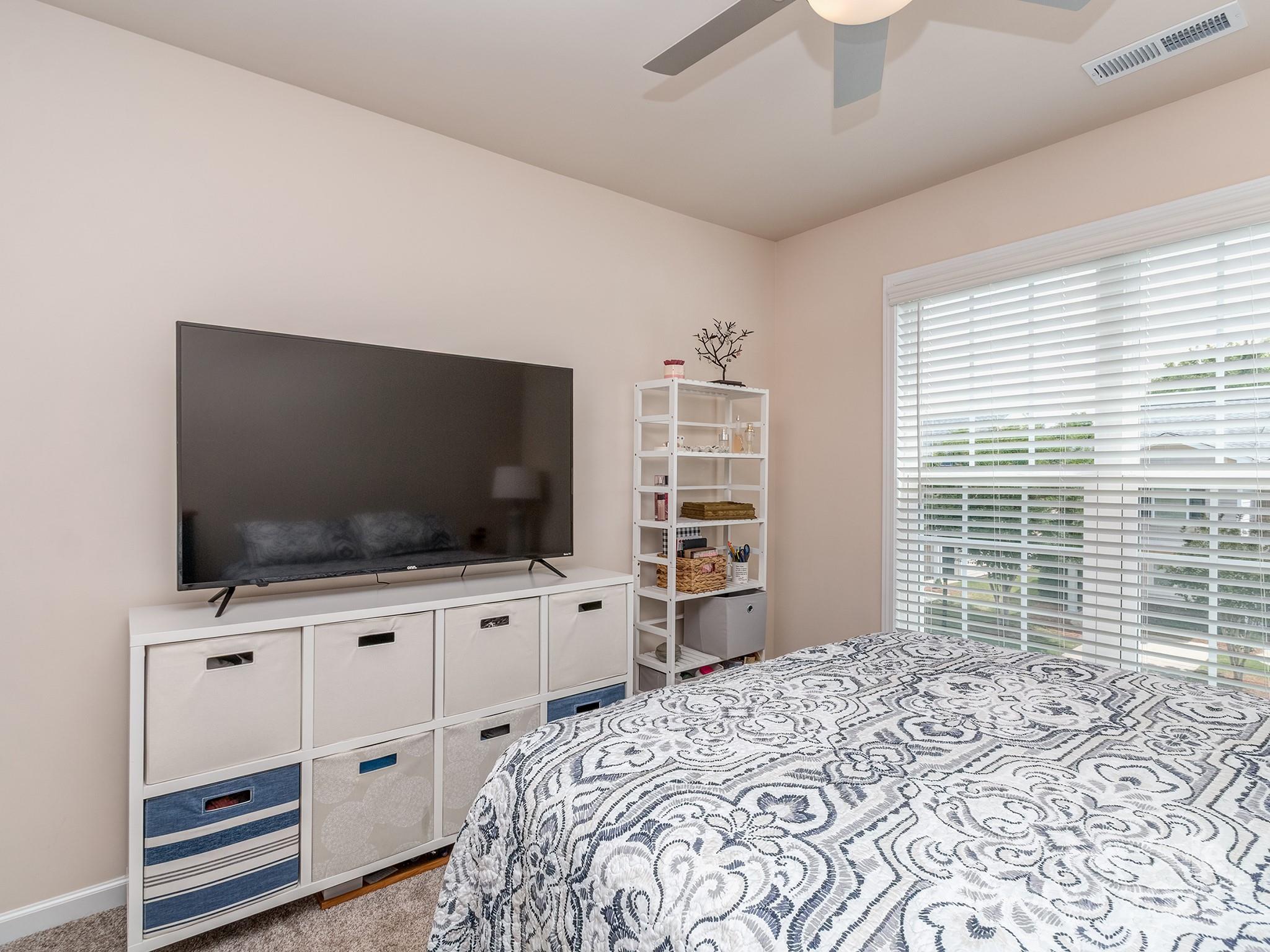 739 Elders Story Road Fort Mill, SC 29708 - Photo 22 of 30 a bedroom with furniture and flat screen tv