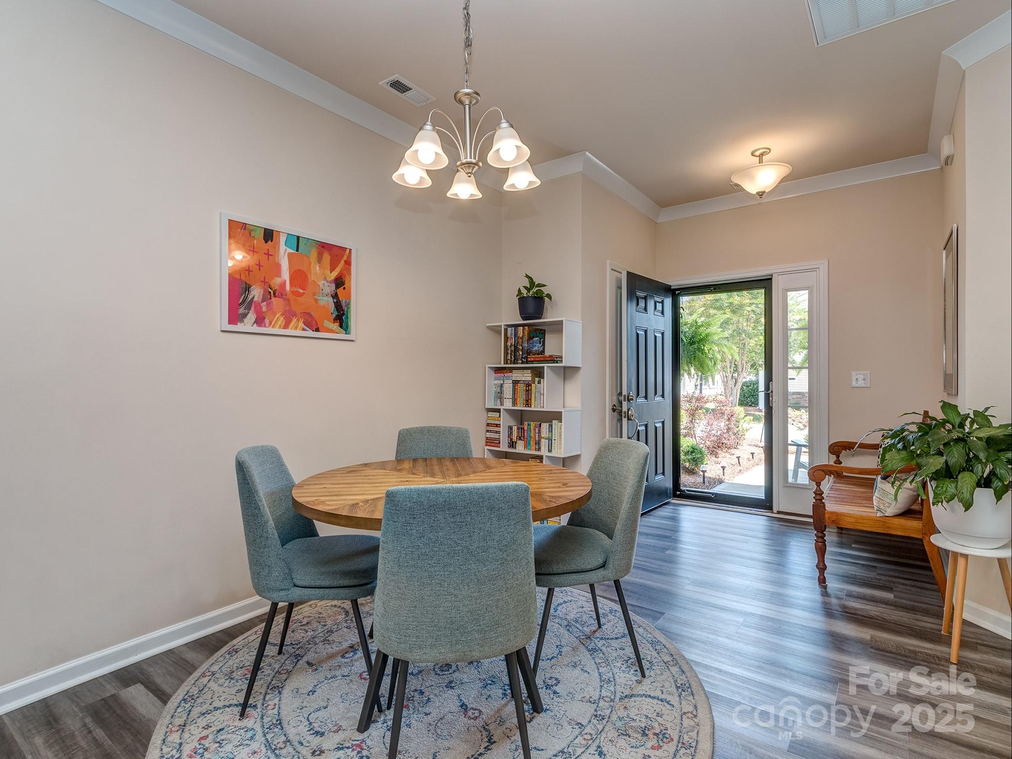 739 Elders Story Road Fort Mill, SC 29708 - Photo 7 of 30 a view of a dining room with furniture window and wooden floor