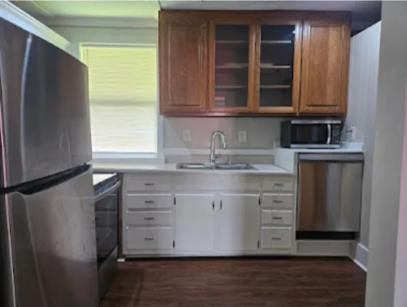 a stove top oven sitting inside of a kitchen