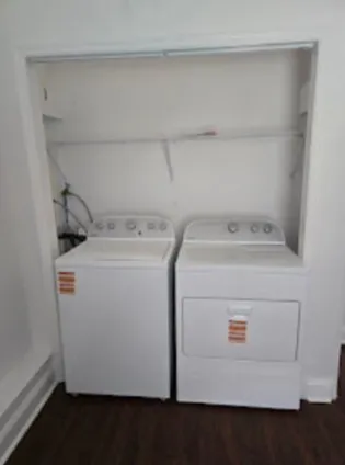 a view of house with backyard and a garden