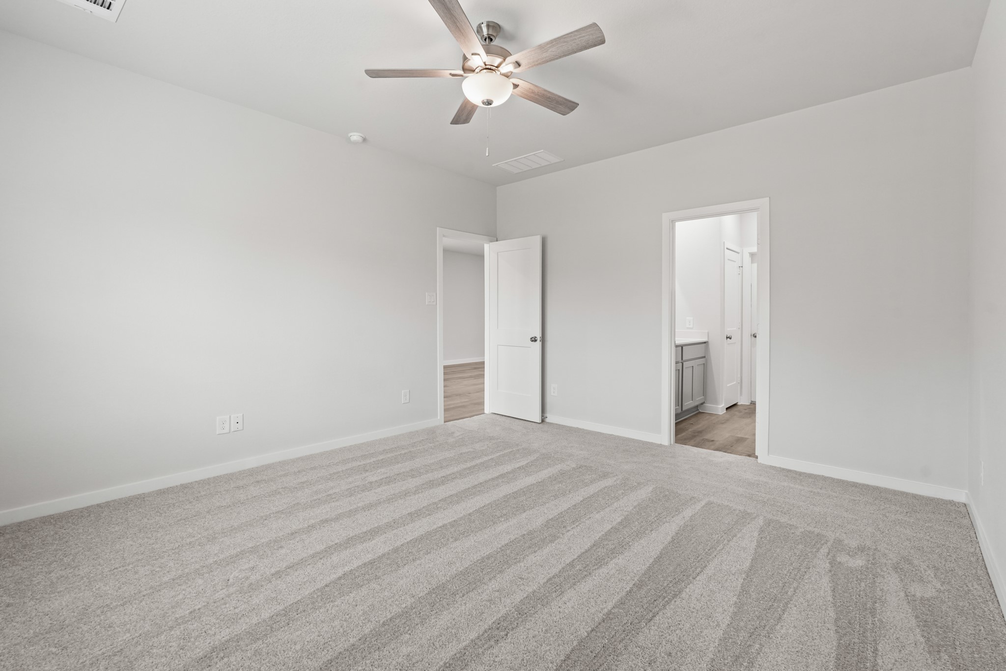 213 Spring Drive Hockley, TX 77447 - Photo 14 of 26 a view of empty room with ceiling fan
