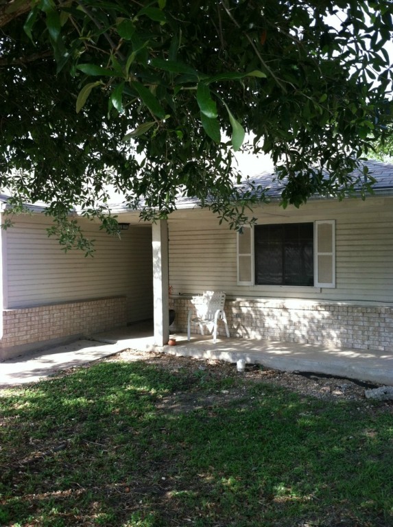 7209 Ritchie Drive Austin, TX 78724 - Photo 1 of 1 a backyard of a house with table and chairs