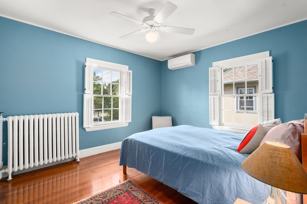 54 Arborway Boston, MA 02130 - Photo 14 of 29 a bedroom with a bed and a window