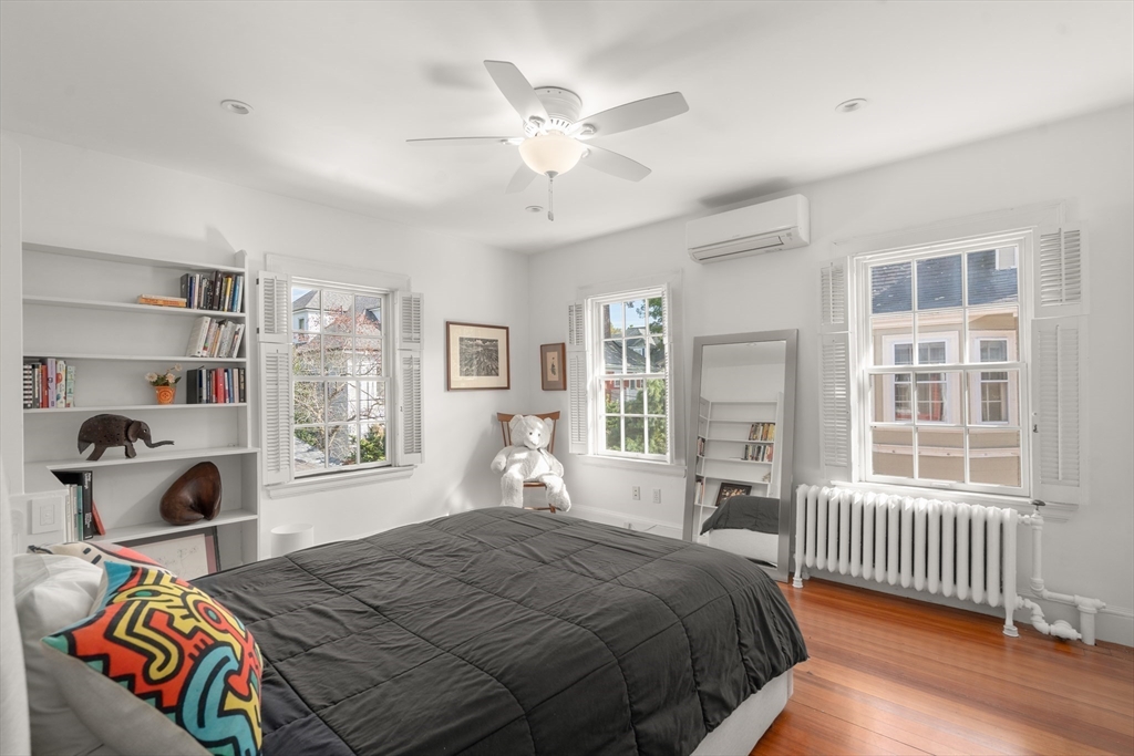 54 Arborway Boston, MA 02130 - Photo 16 of 29 a bedroom with a bed and a window