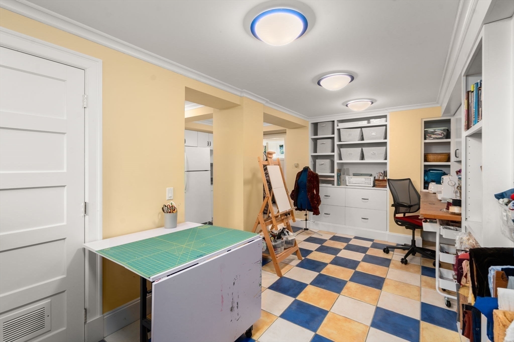 54 Arborway Boston, MA 02130 - Photo 20 of 29 a room with furniture and gym equipment