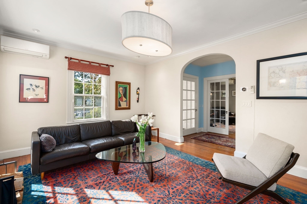 54 Arborway Boston, MA 02130 - Photo 3 of 29 a living room with furniture a rug and a window