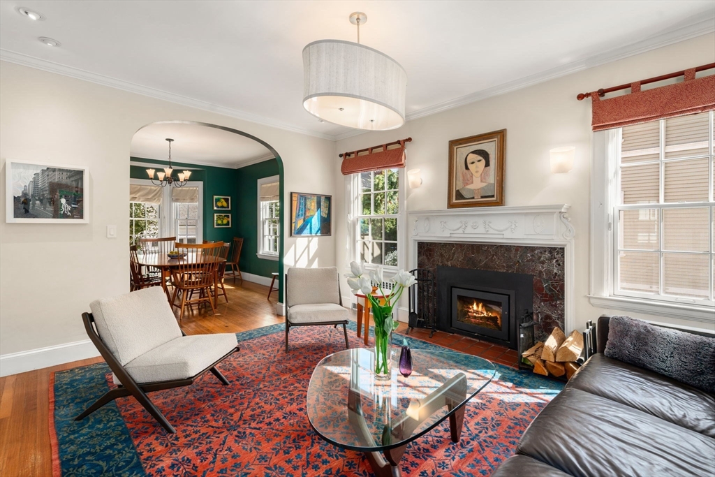 54 Arborway Boston, MA 02130 - Photo 4 of 29 a living room with furniture a fireplace and window