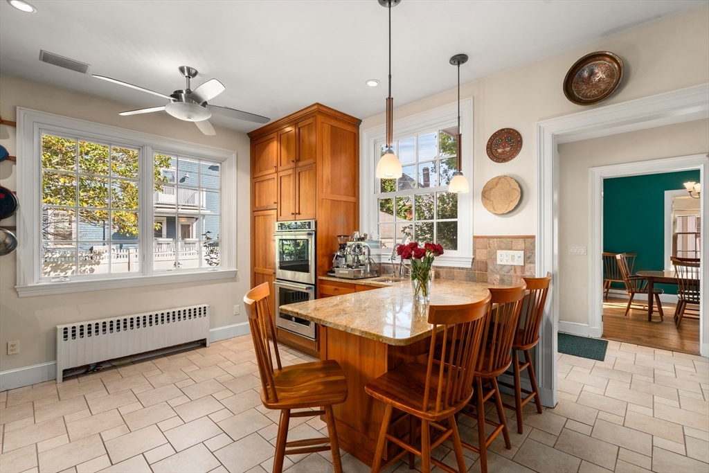 54 Arborway Boston, MA 02130 - Photo 6 of 29 a dining room with furniture and a large window