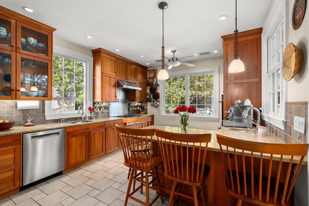 54 Arborway Boston, MA 02130 - Photo 7 of 29 a dining table with chairs and window